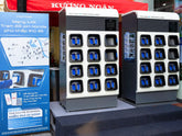 Honda e:Swap battery swapping station with two 12-slot cabinets and network map display in Hanoi, Vietnam